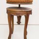 Swivel piano stool with screw, Louis XV style, in walnut.