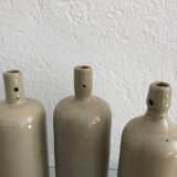 Trio of vintage stoneware bottles