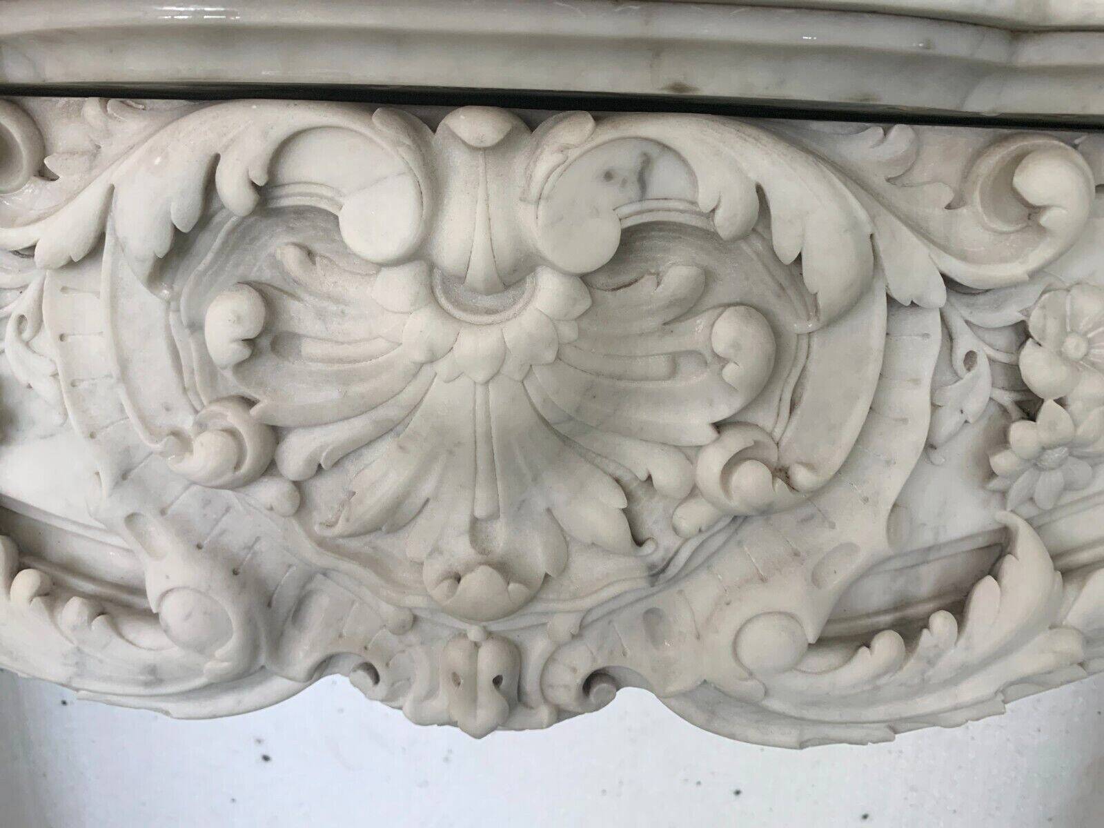 Louis XV style fireplace in white Carrara marble 19th century