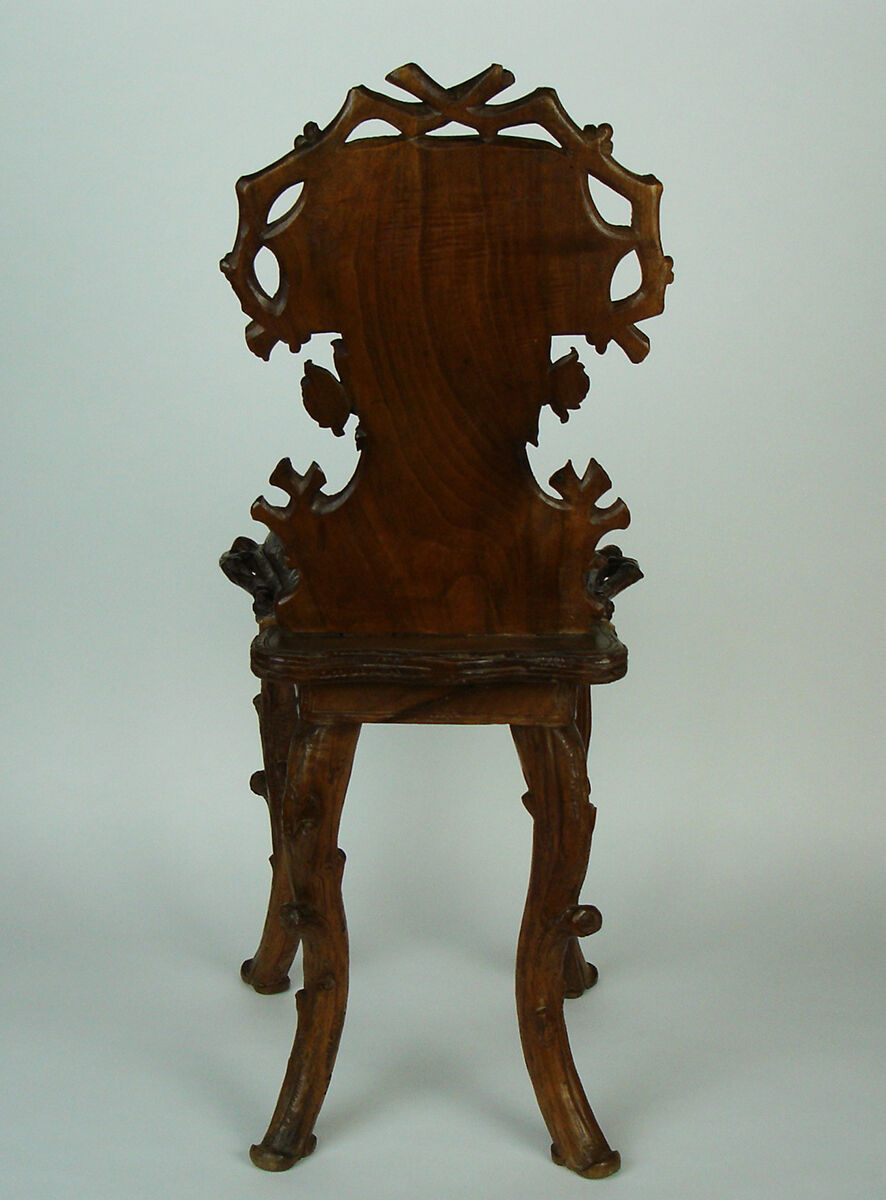 Sculpted chair in "black drill" style