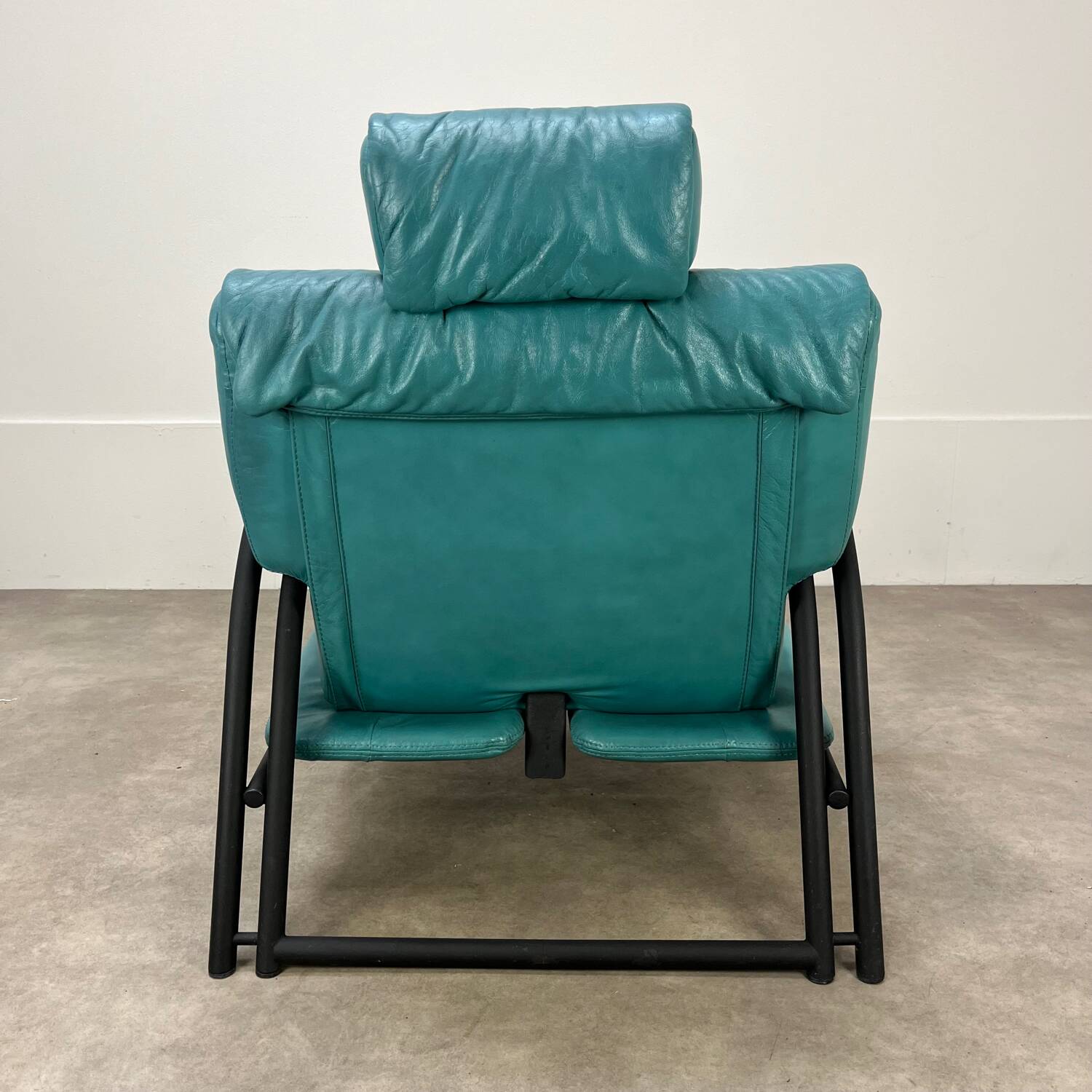 Postmodern design armchair and ottoman, 80s leather