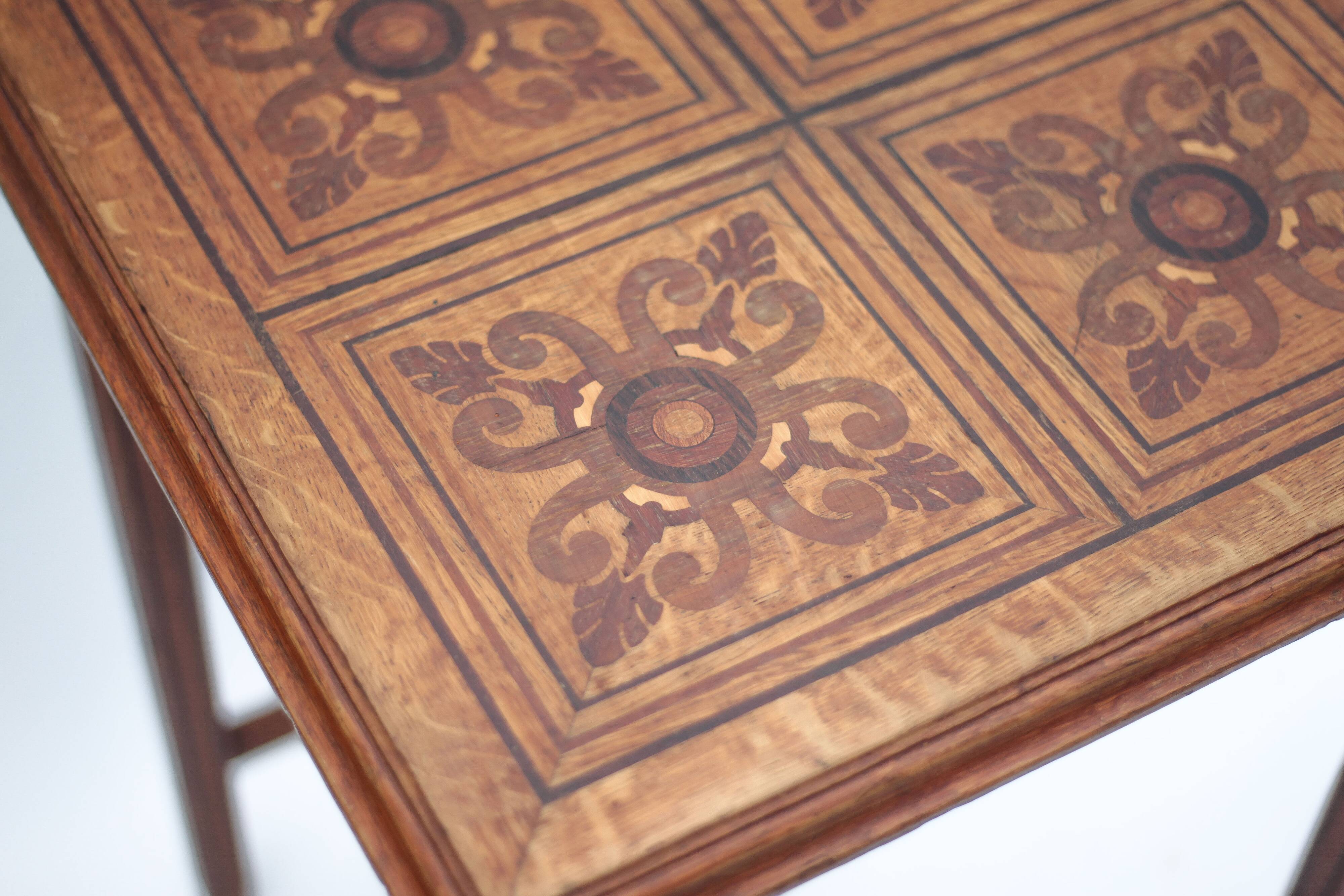 Wood table with marquetry, table with an antique parquet top, antique table.
