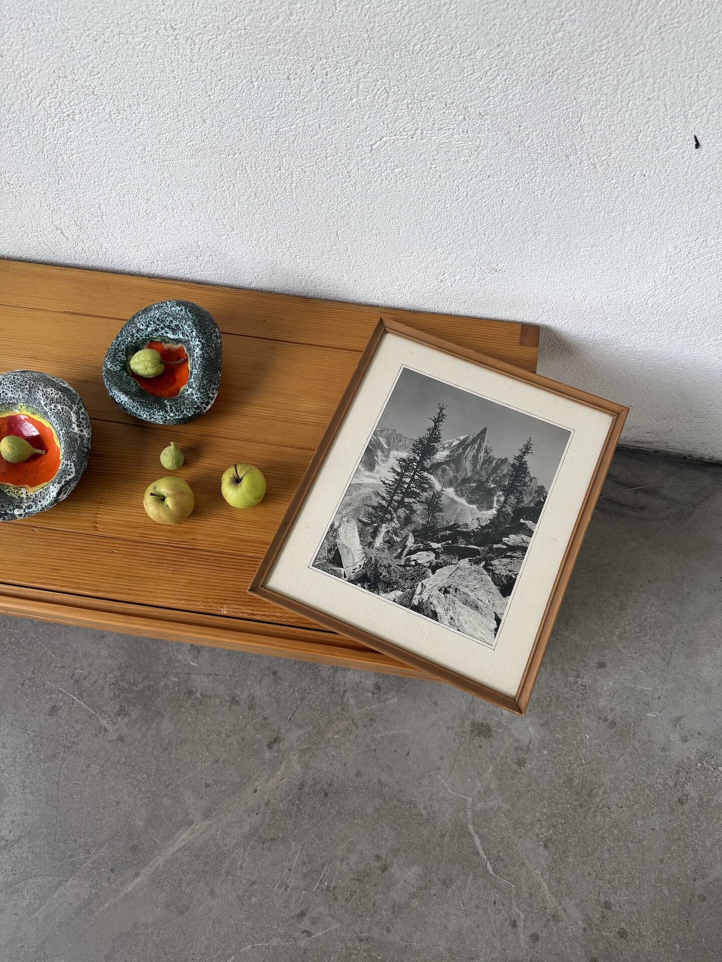 Framed old photo of a mountain landscape.