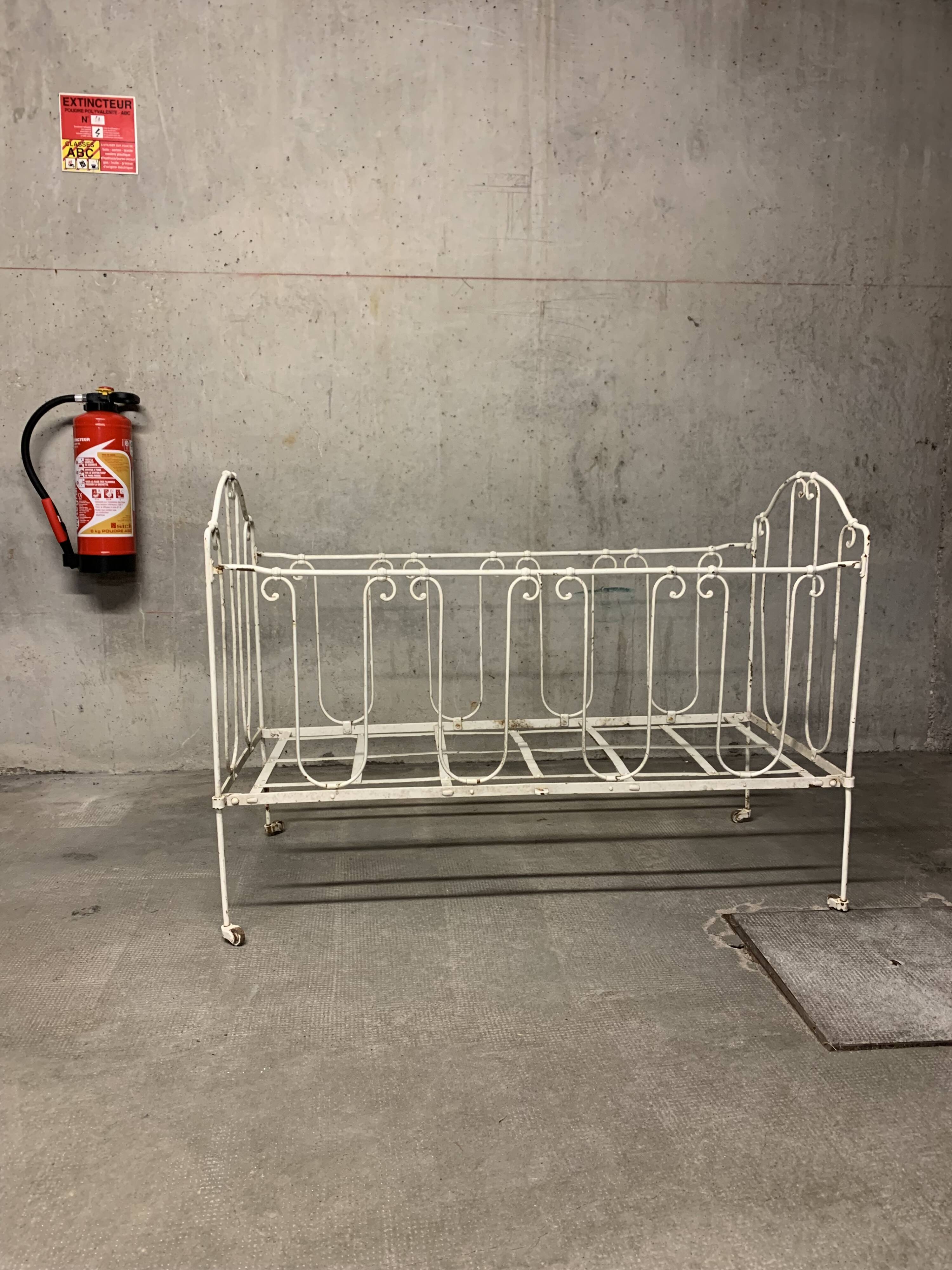 Old vintage wrought iron bench bed