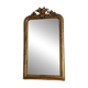 Golden mirror from the late 19th century with a decorated pediment. 130x74.