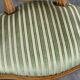 Pair of Louis XVI style armchairs in striped green fabric, 20th century.