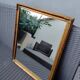 Miroir en bois, doré à la feuille d'or.