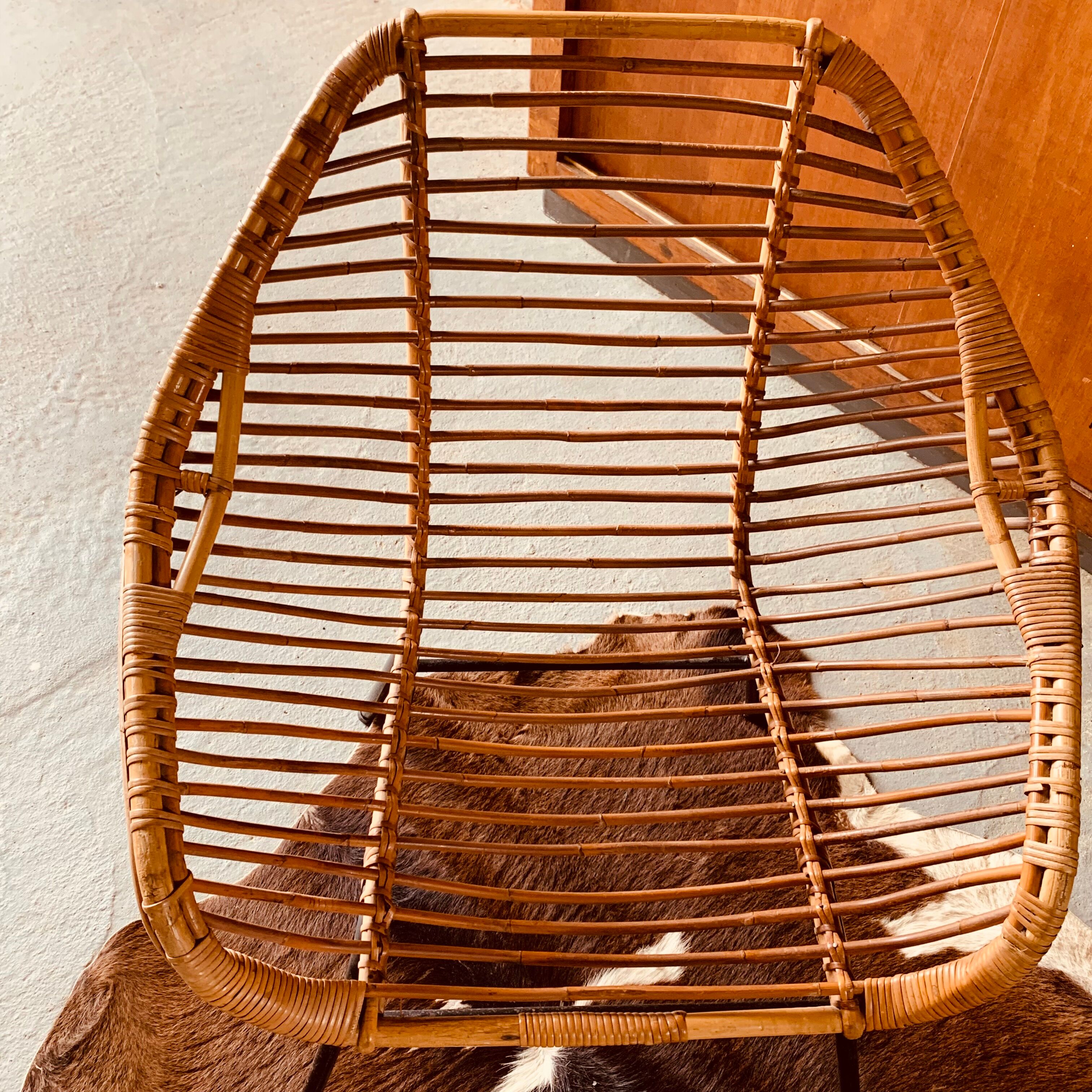 Rattan armchair and black metal base 1960