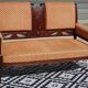 Old bench in wood and orange velvet