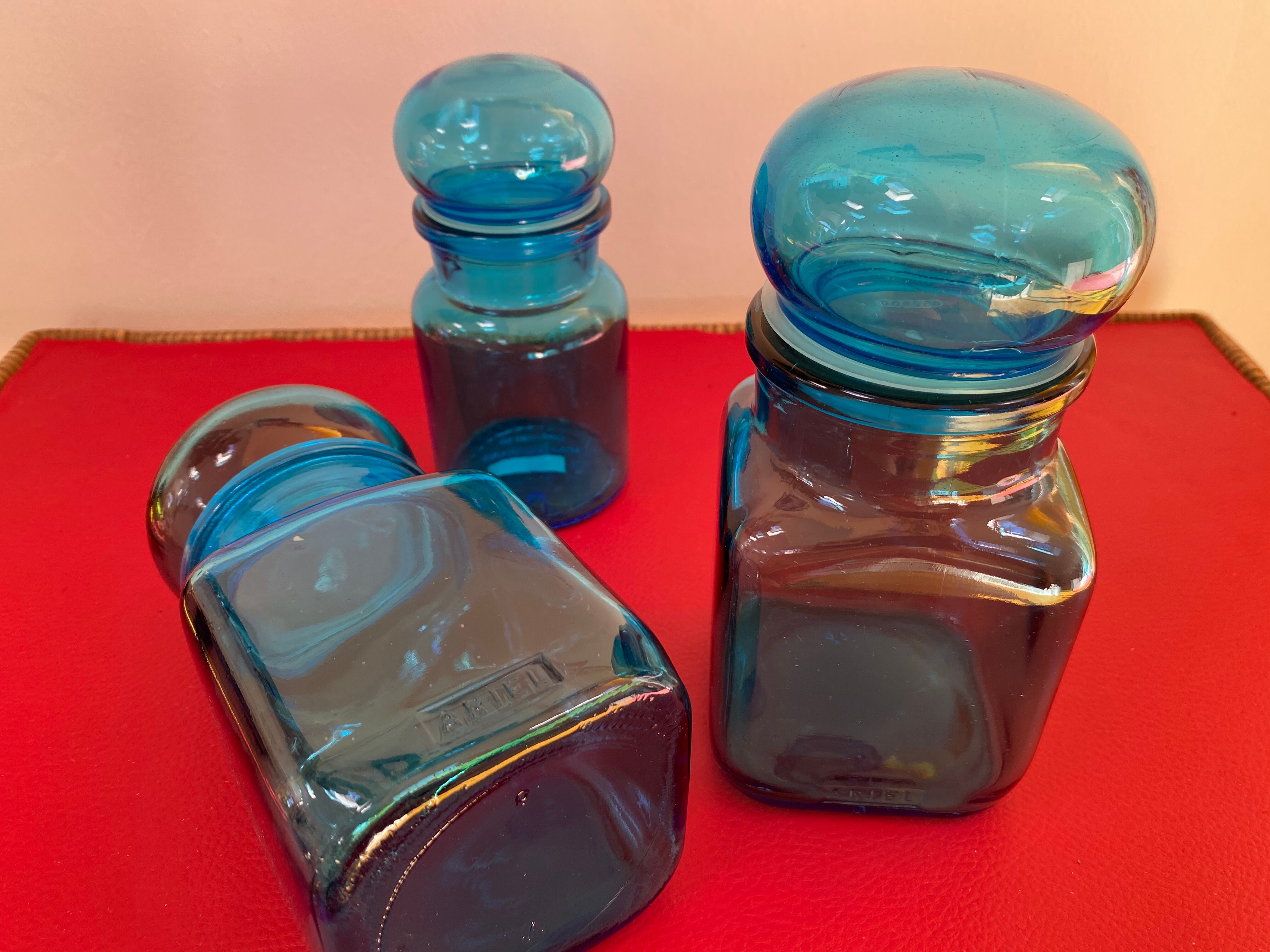 Trio of vintage turquoise blue glass jars