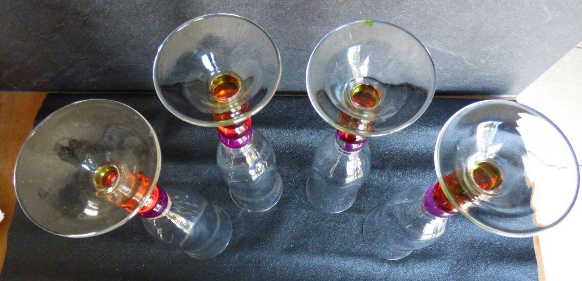 4 vintage flutes with coloured glass stems