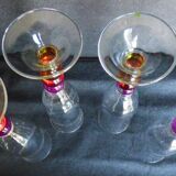 4 vintage flutes with coloured glass stems