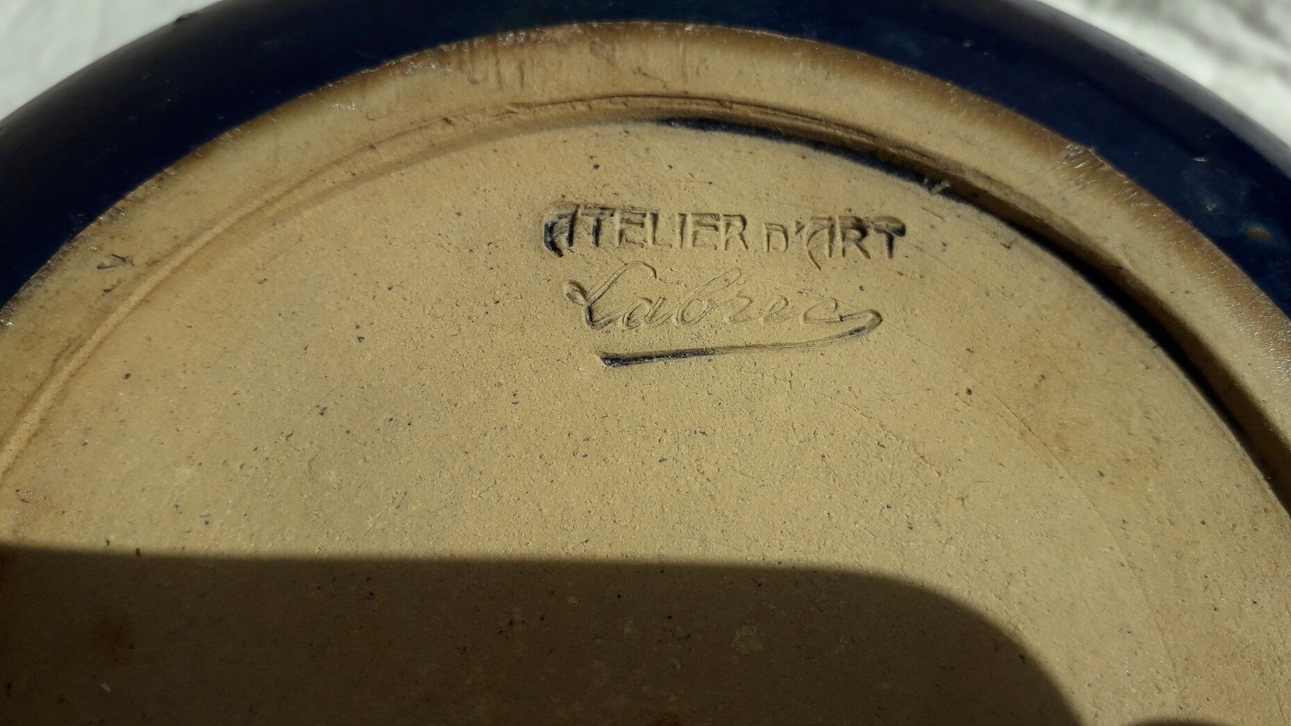 Signed stoneware pot cover