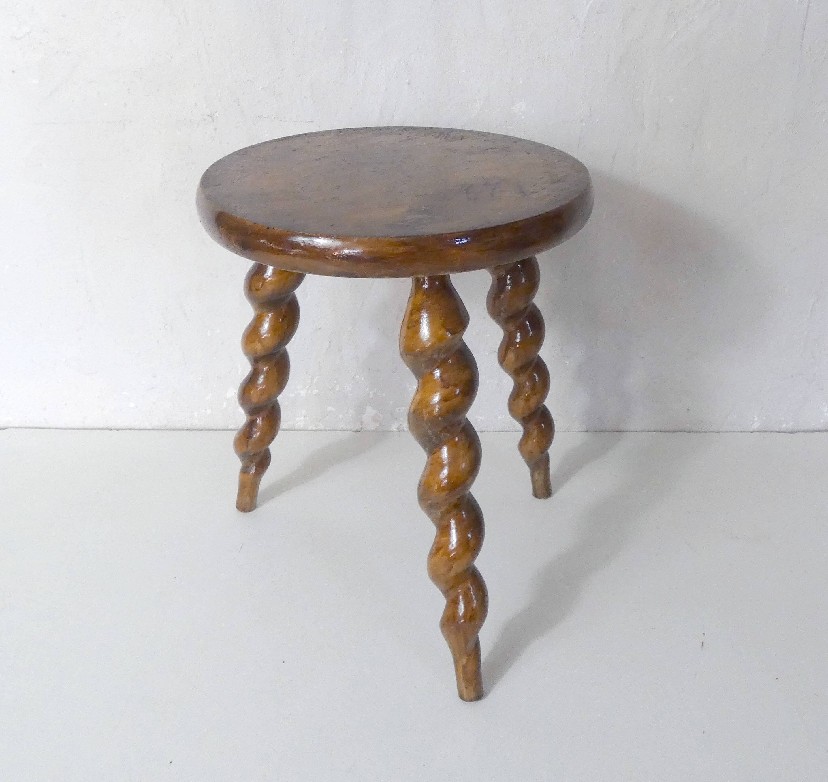 old tripod stool plant holder in turned wood