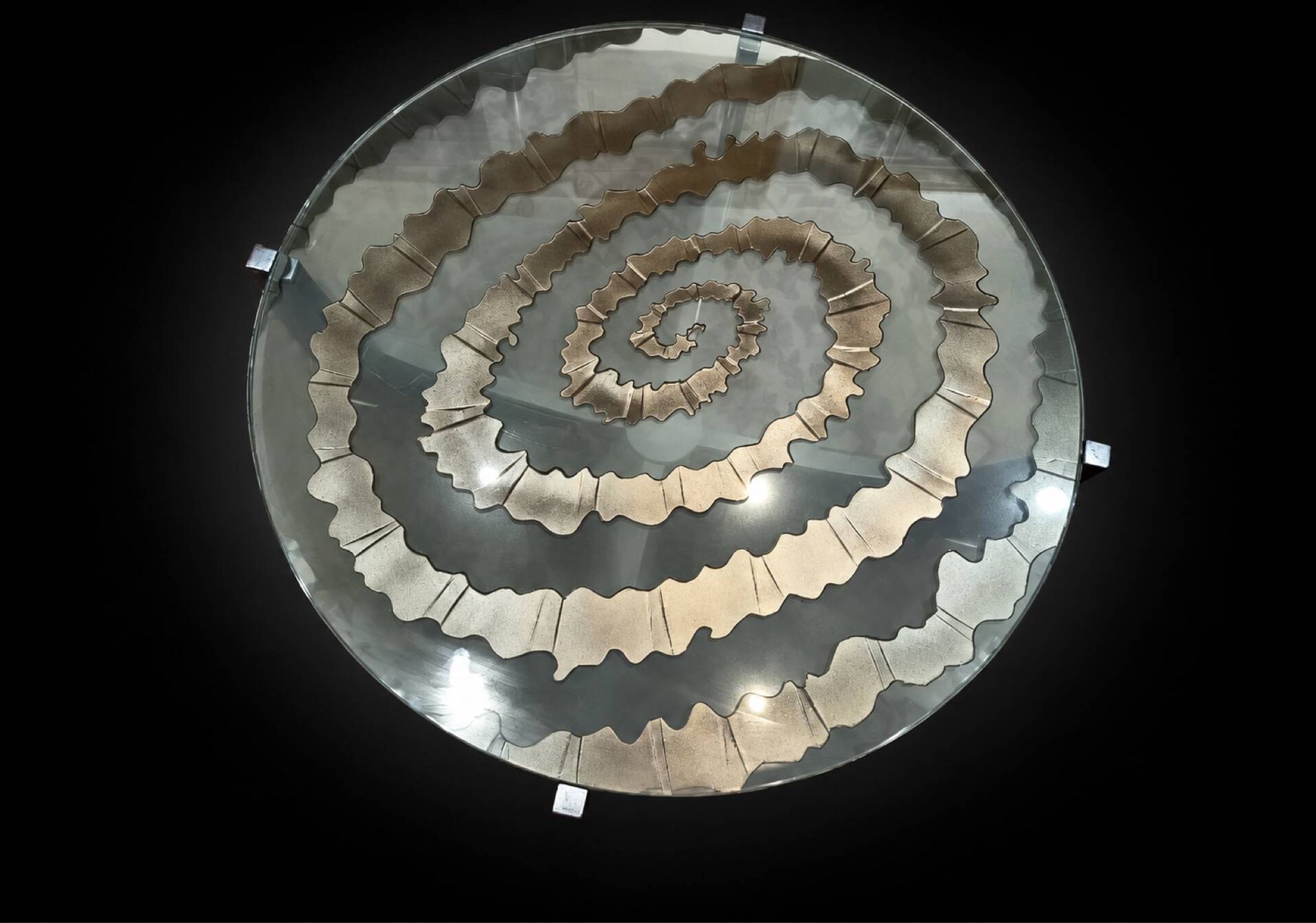Round coffee table with double glass top, spiral carved decoration.