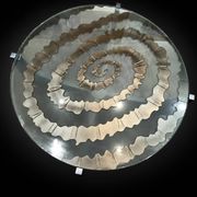 Round coffee table with double glass top, spiral carved decoration.