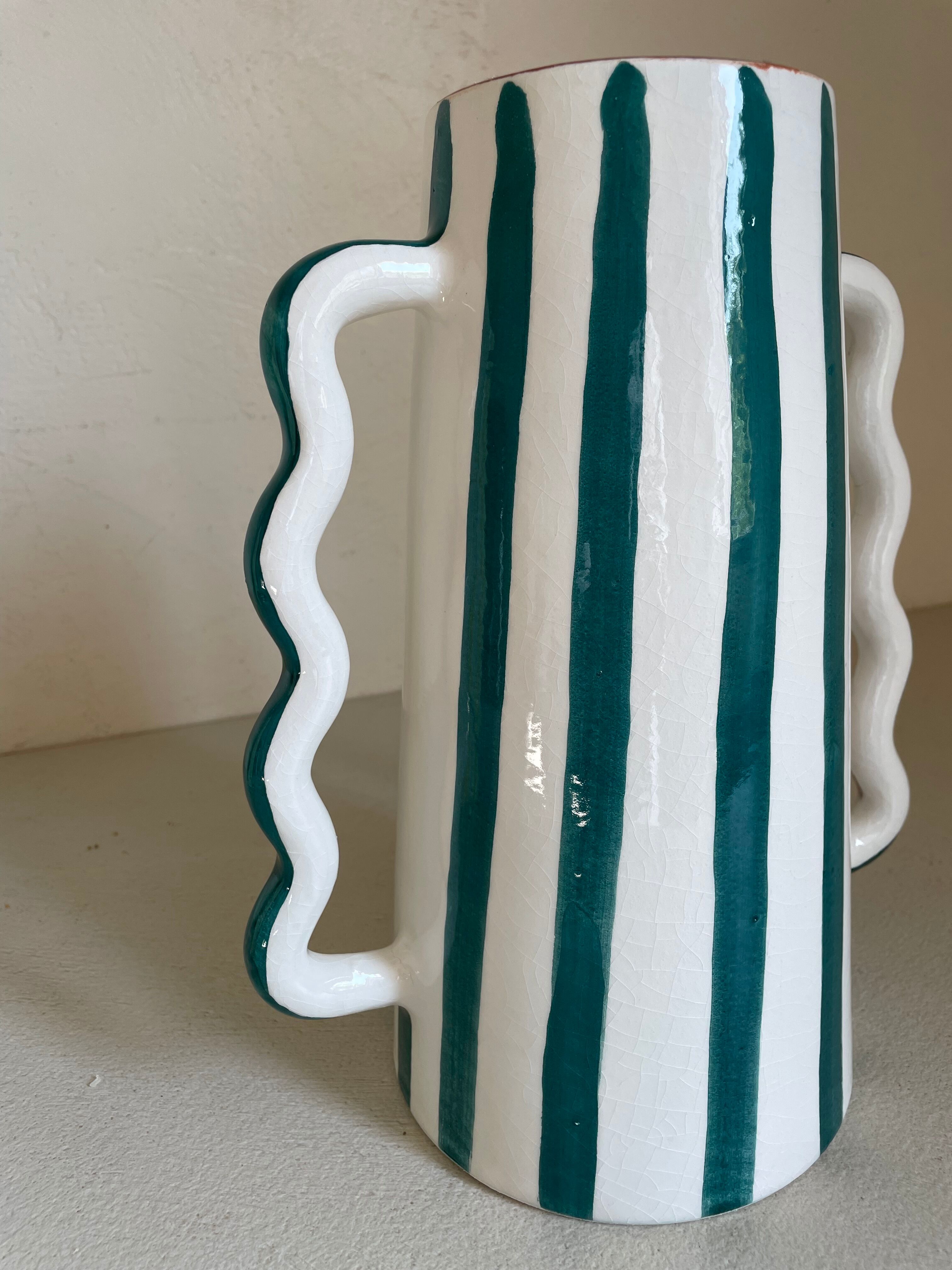 Fir and white green striped ceramic vase with handmade abstract wavy handles
