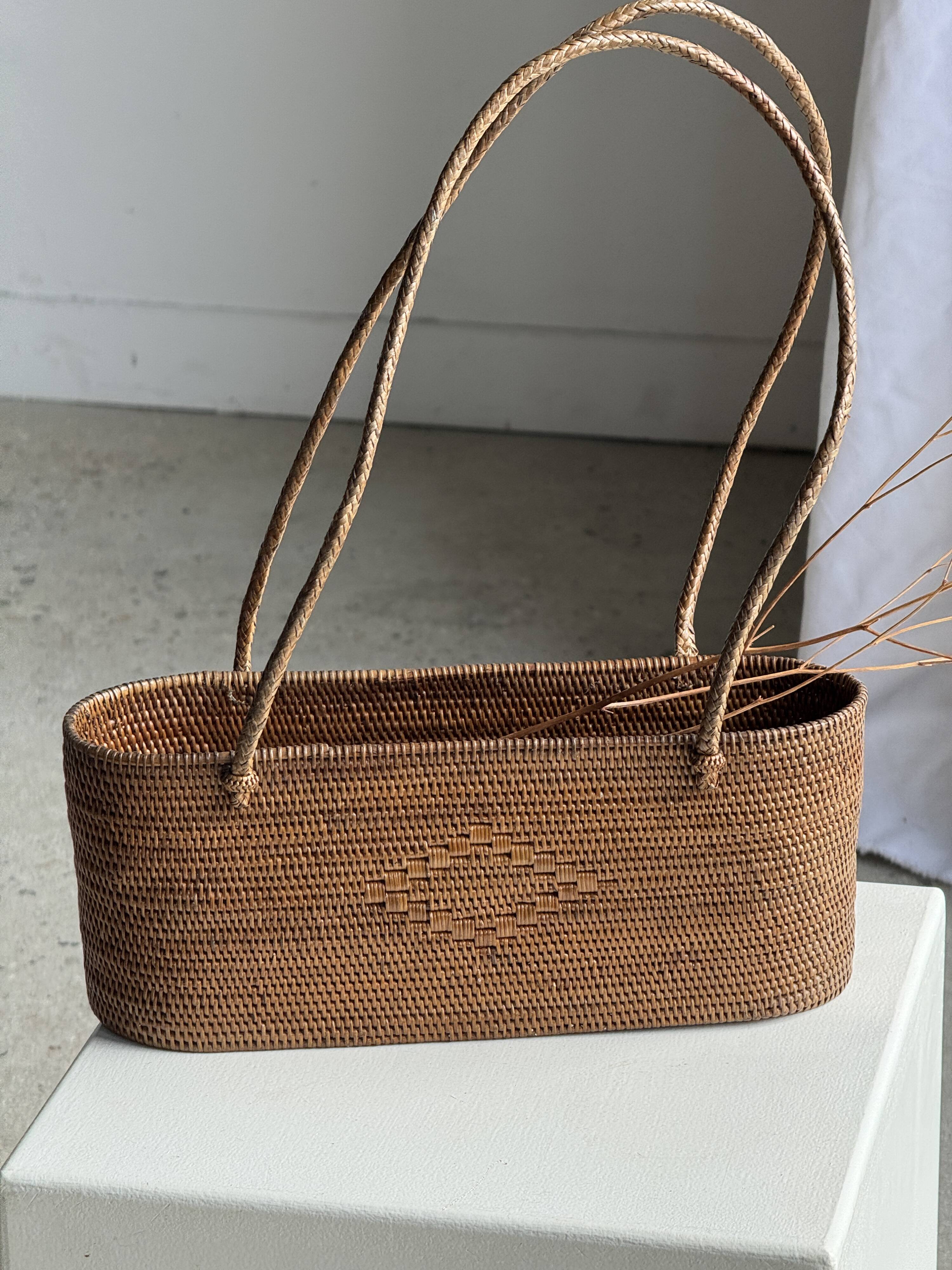 Small oval basket with long handles, traditional Indonesian L28xH10