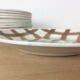10 ceramic "nappe" plates from the Moulin des Loups, brown