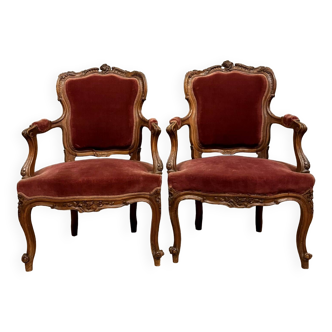 Superb pair of Louis XV Rocaille style convertible armchairs in walnut