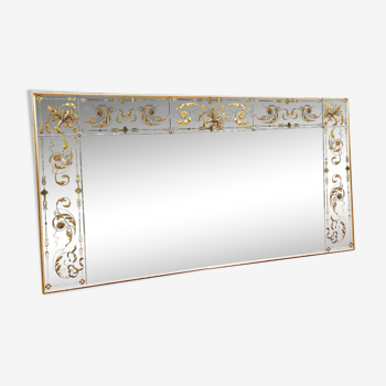 Glass mirror with a decoration engraved with golden foliage 1960