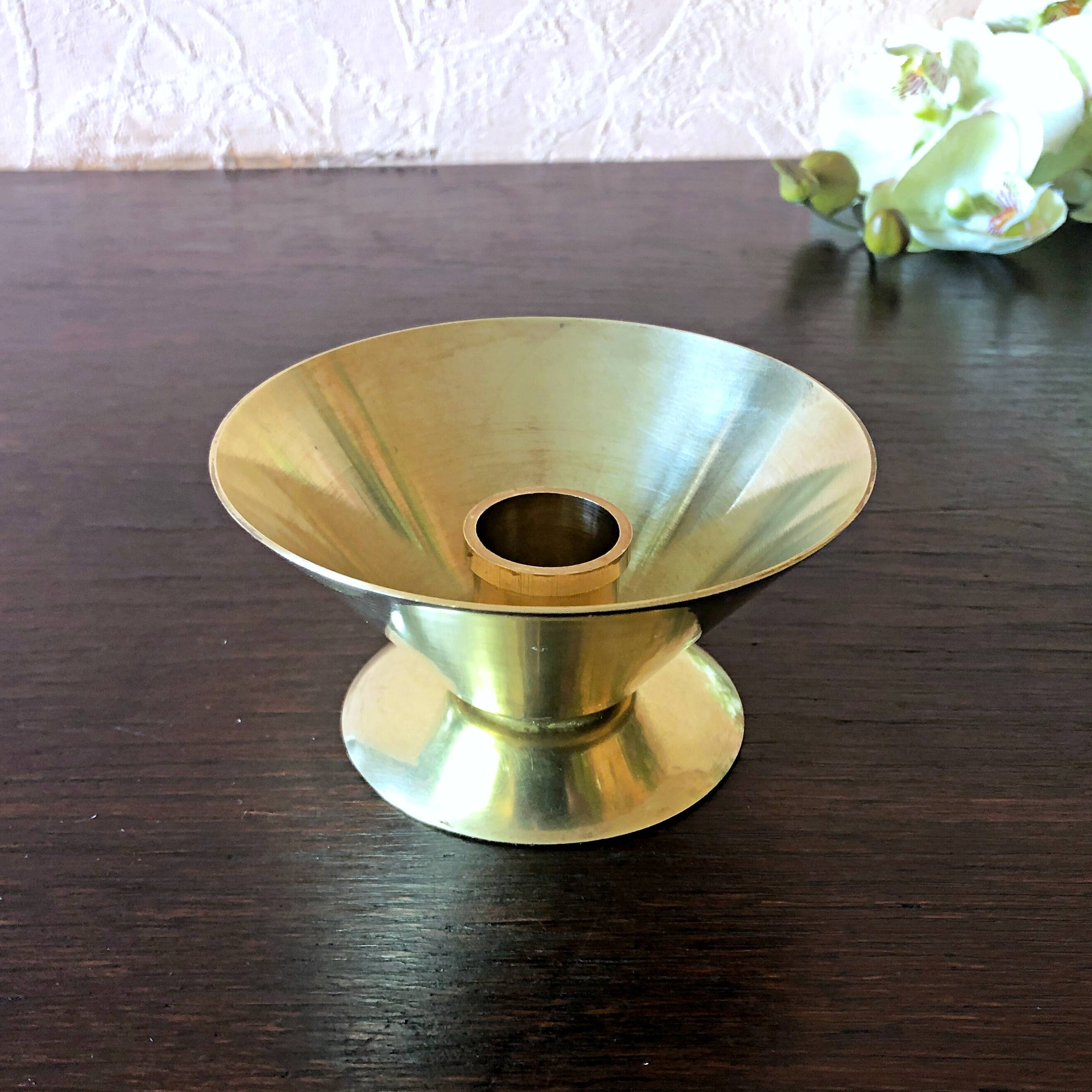 Table candle holder in golden brass