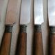 Old table knives and dessert knives, wooden handles, stainless steel blades