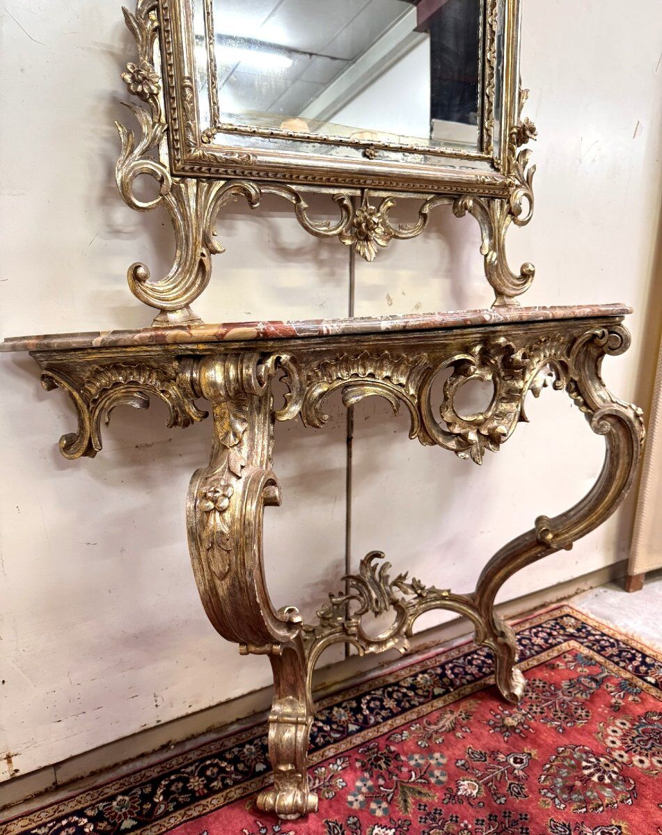 Important console table with a curved shape + Louis XV style mirror in gilded and silvered wood.