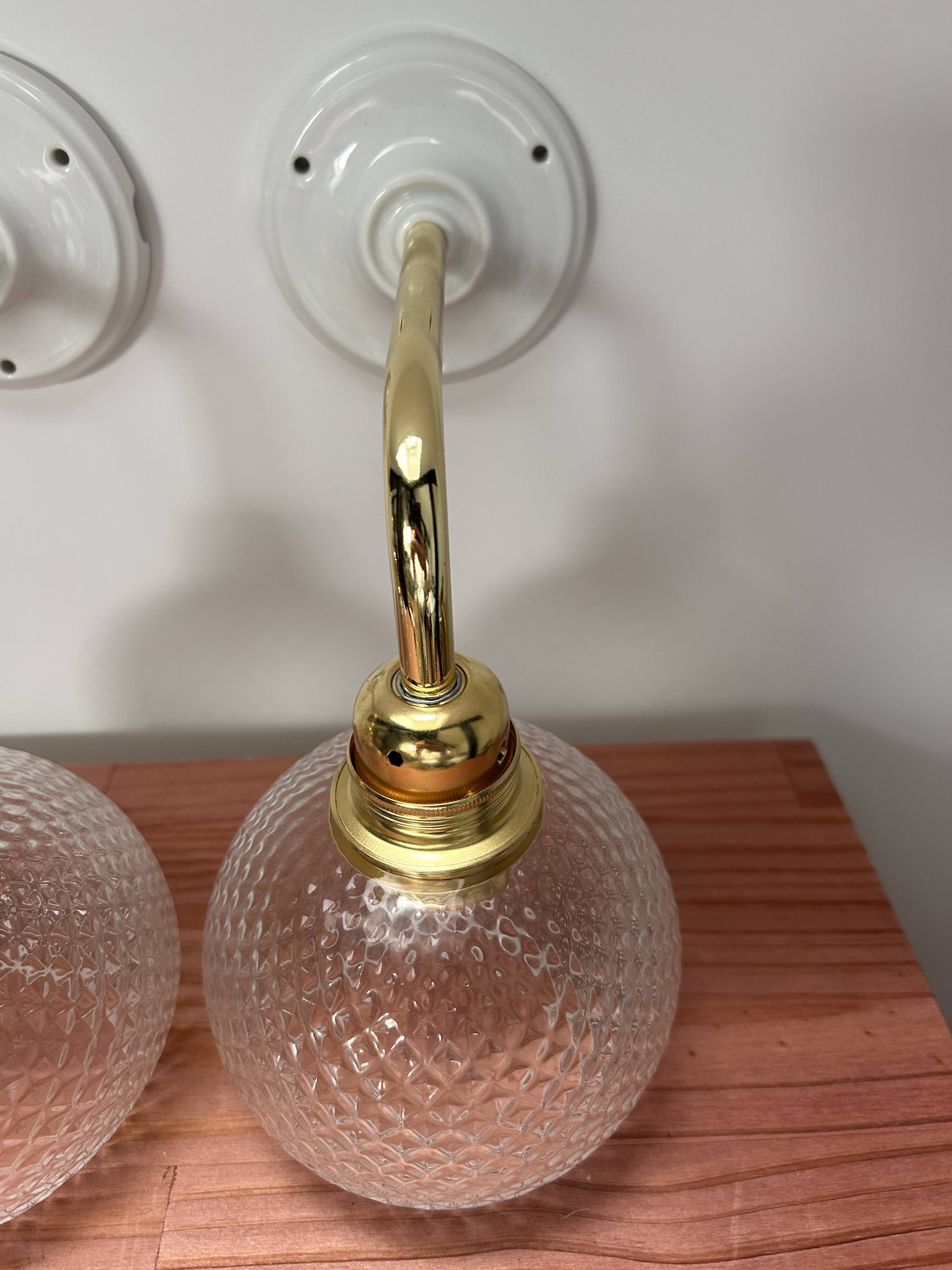 Pair of chiseled glass wall sconces