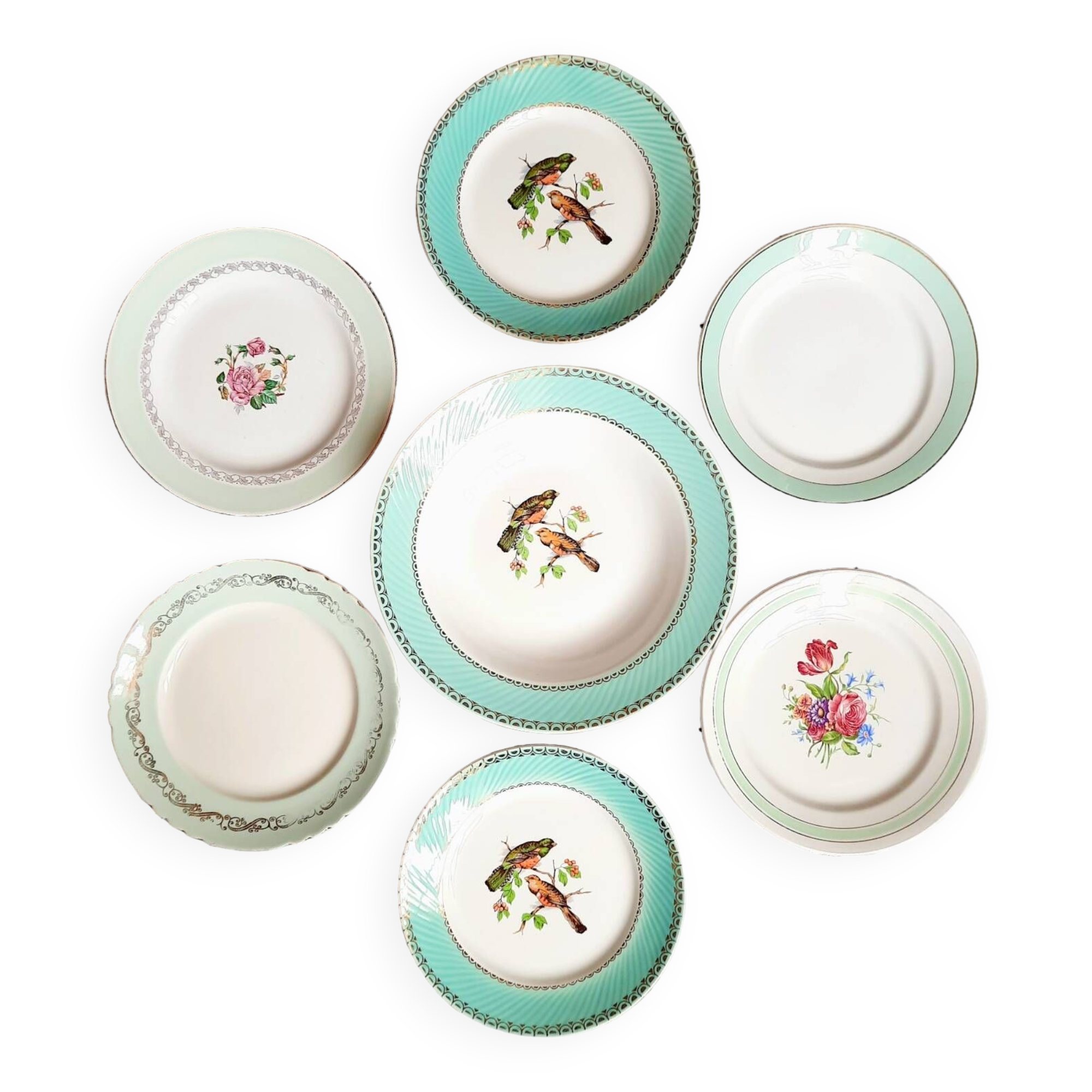 Old mismatched earthenware dinner plates accompanied by a deep dish