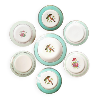 Old mismatched earthenware dinner plates accompanied by a deep dish