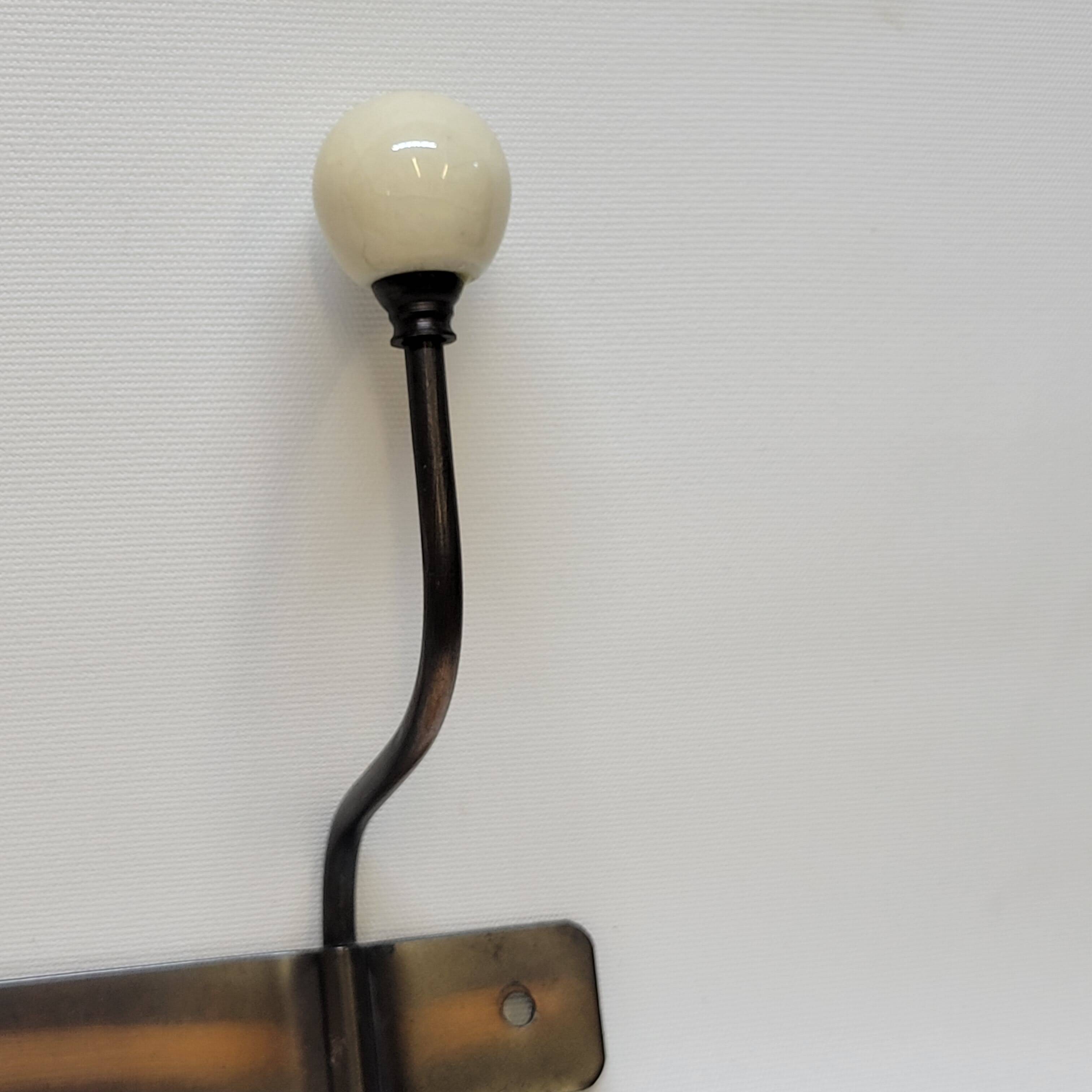 Wall coat rack in metal and porcelain with 2 hooks