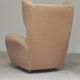 Beige wingback armchair and TVAR footrest, former Czechoslovakia.