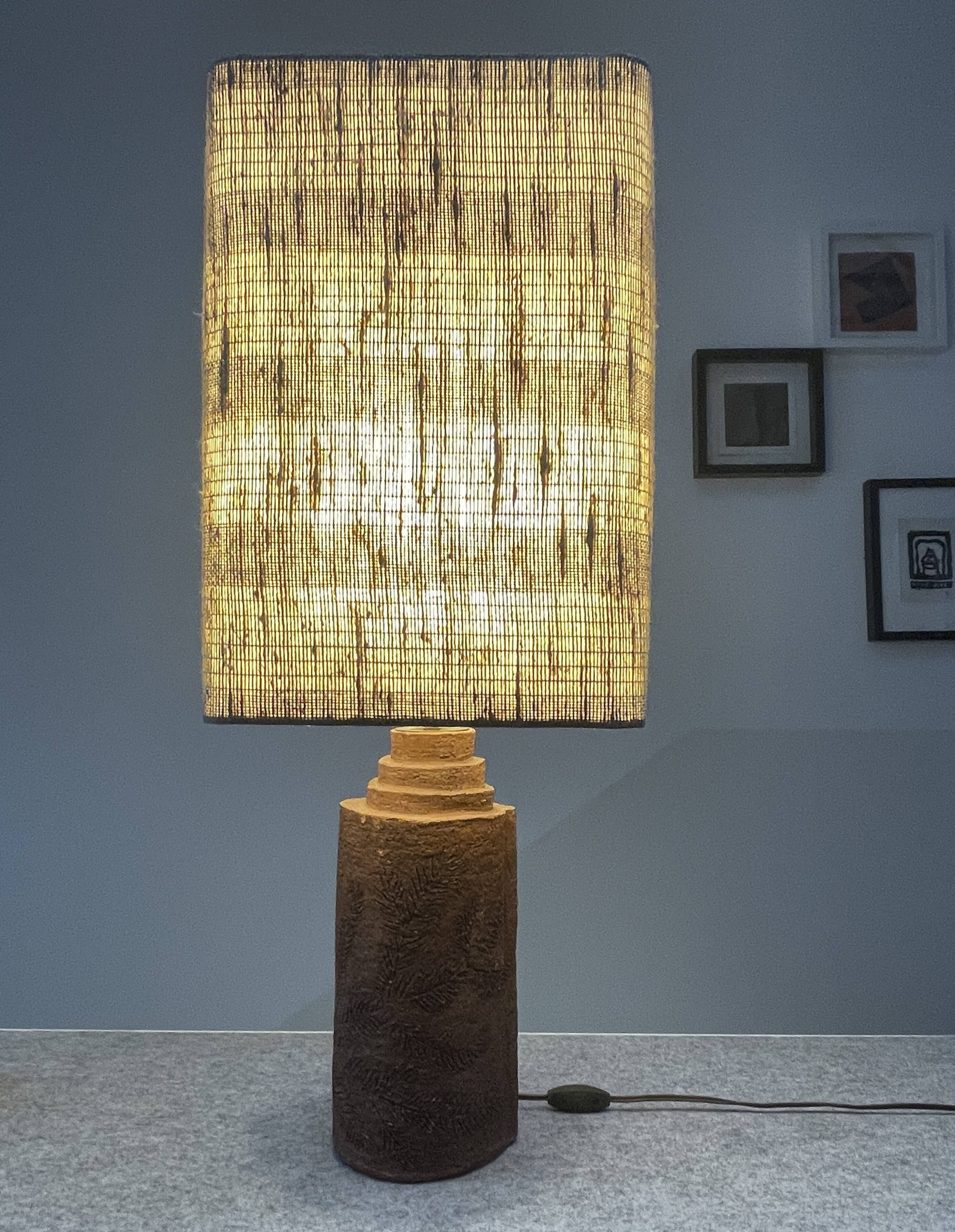 Large chamotte clay lamp in brutalist style, with a plant motif.