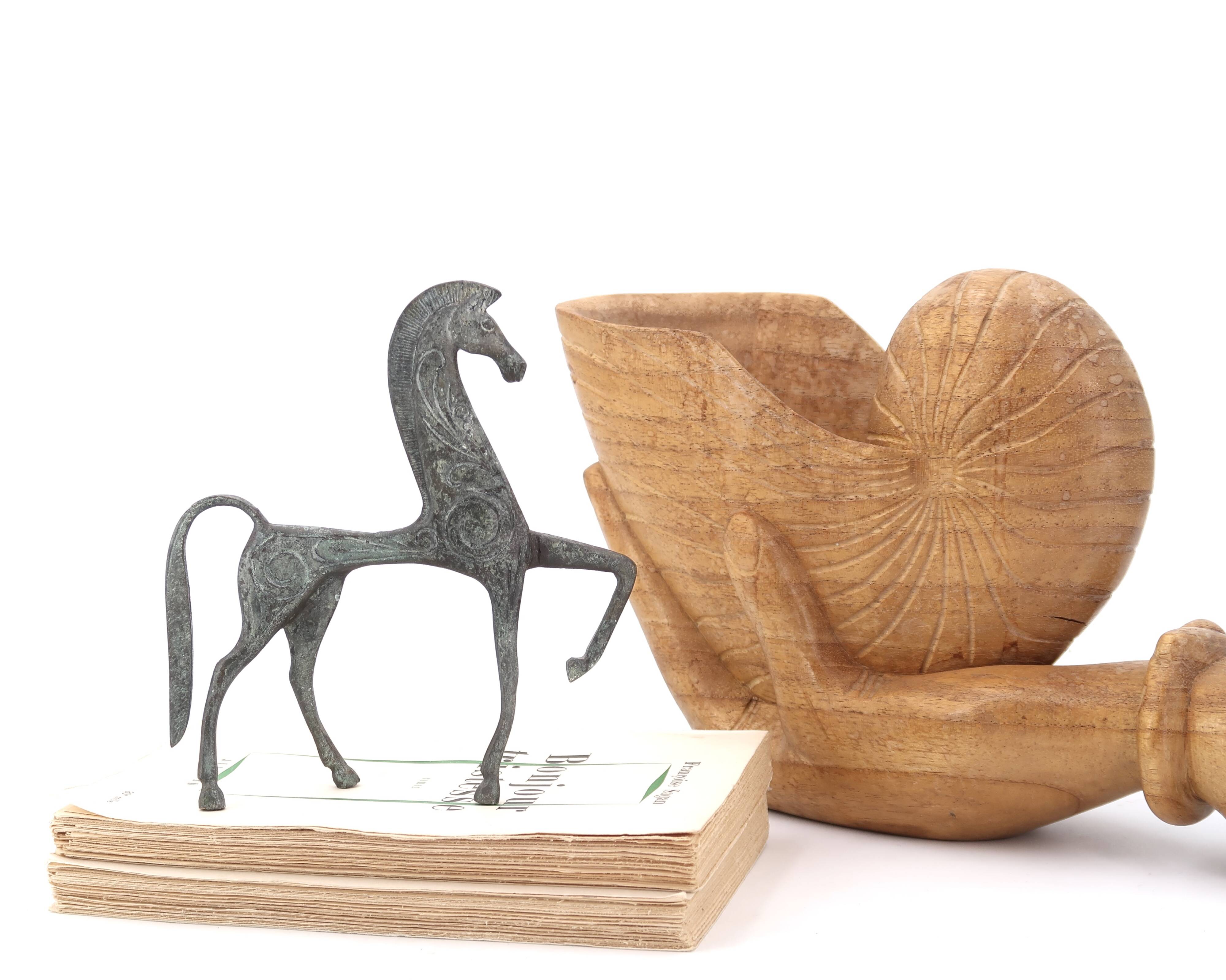 Wooden hand emptier holding a shell, 1970s