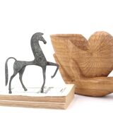 Wooden hand emptier holding a shell, 1970s