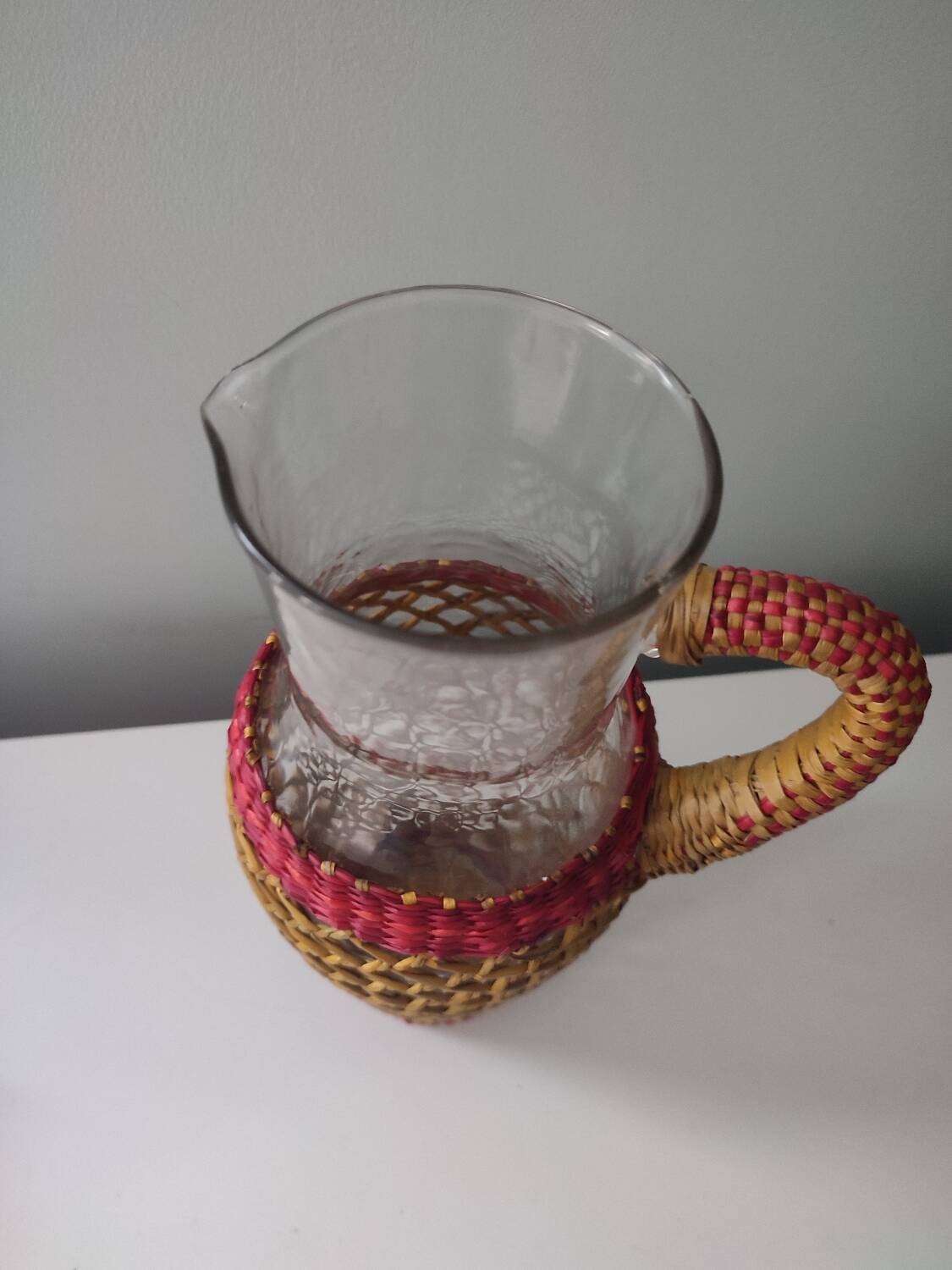 Glass and raffia water carafe