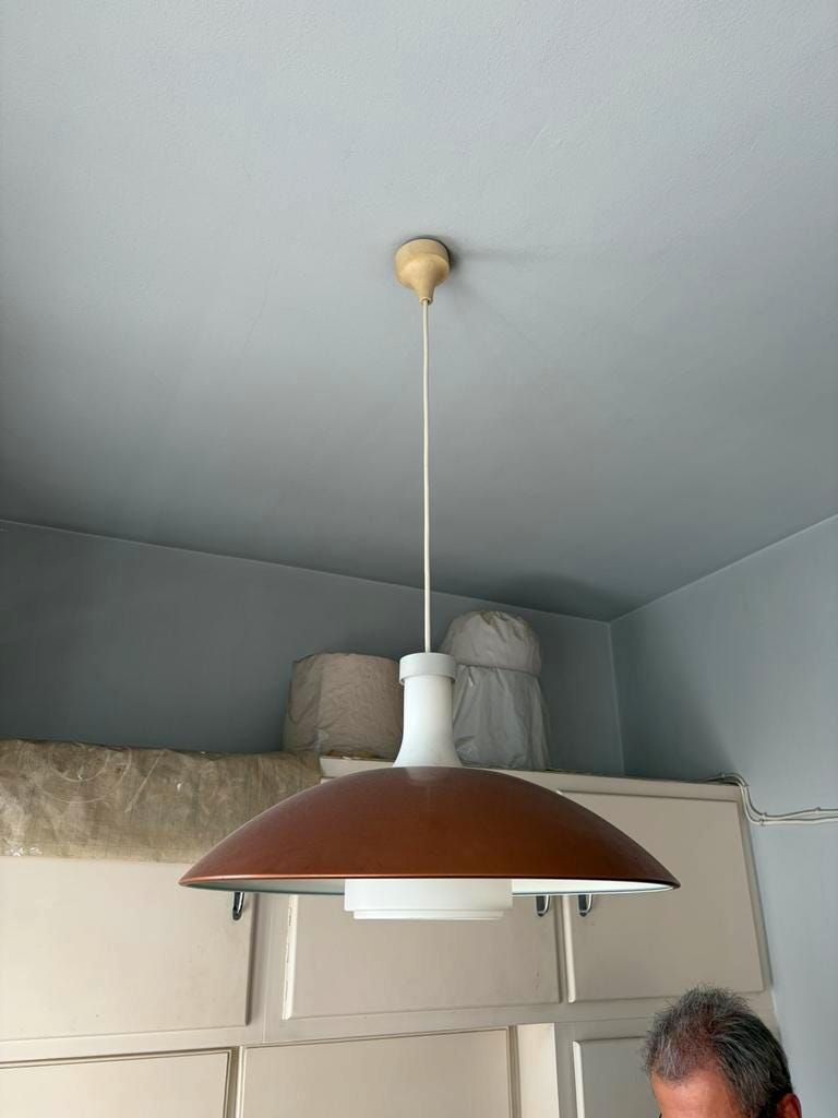 Vintage orange rust metal pendant light with opaline glass.