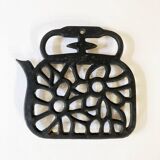 Old enameled cast iron trivet