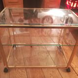 Trolley on wheels in gilded brass and beveled glass