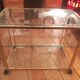 Trolley on wheels in gilded brass and beveled glass