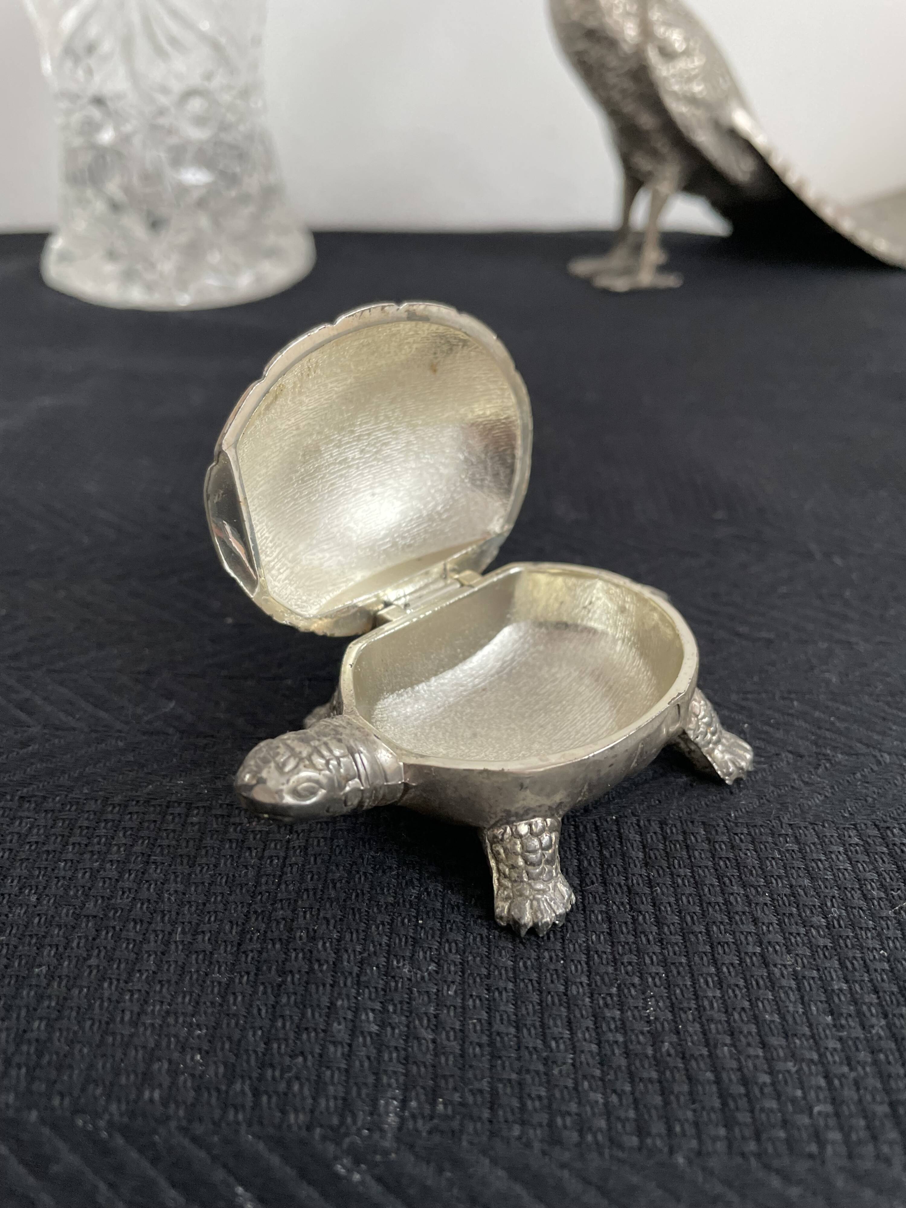 Ancient tortoise in silver metal