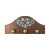 The wooden coat rack with floral motif