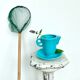 Milk jug on plate