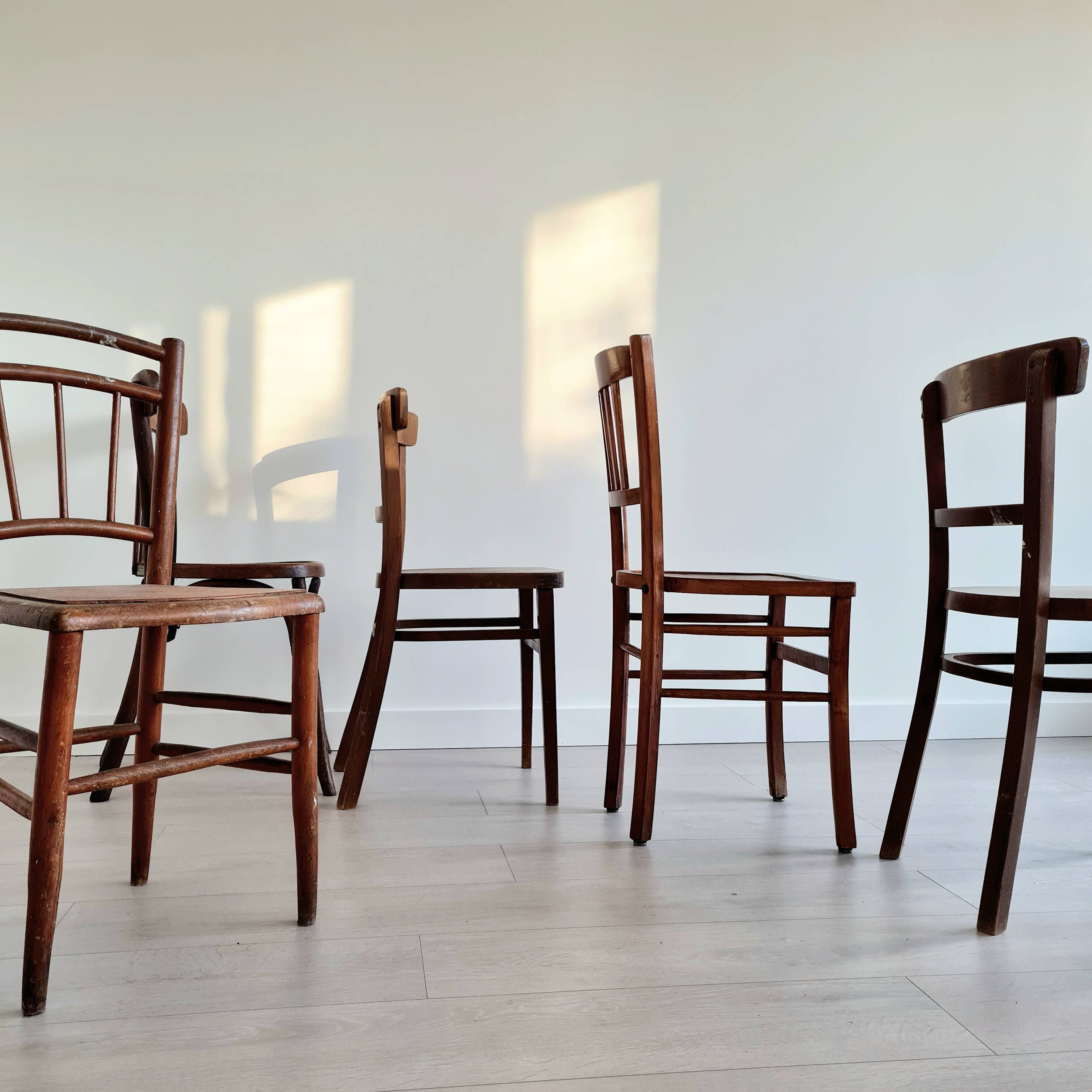 Mismatched wooden bistro chairs