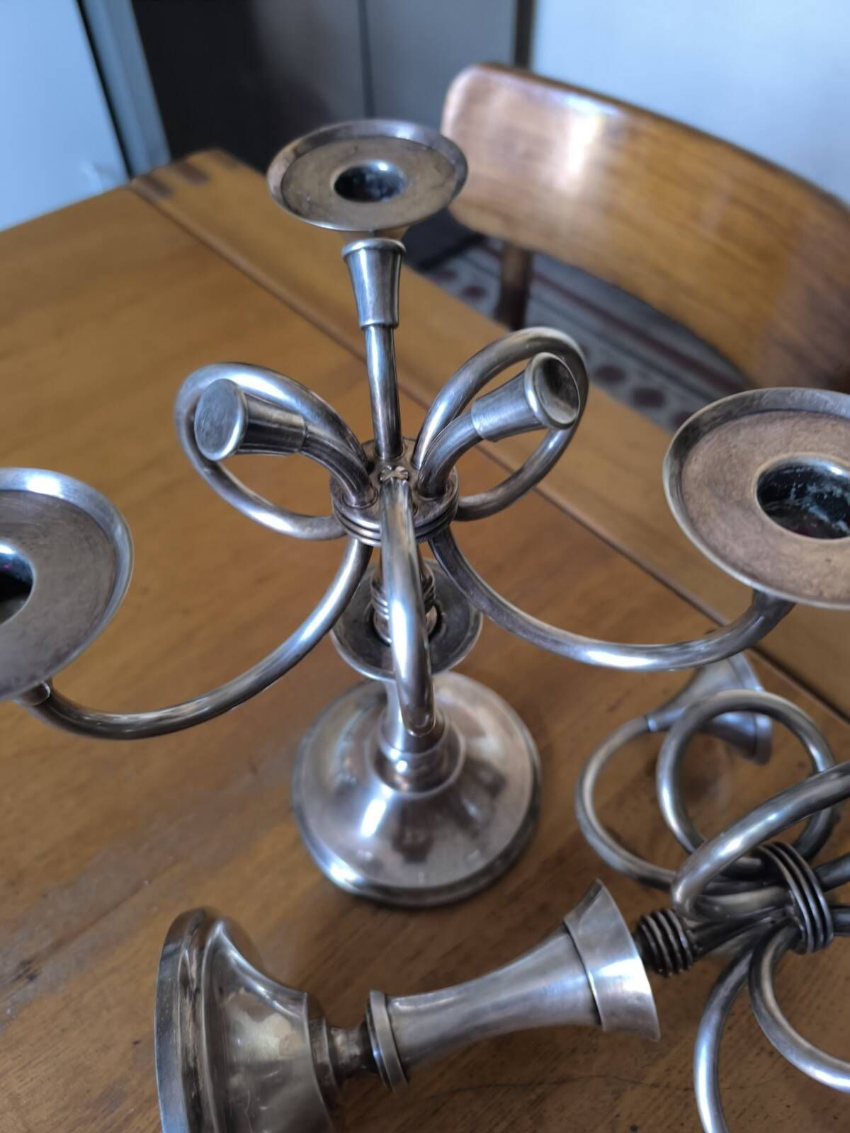 Ercuis pair of candlesticks model Cheverny in silver-plated metal with hunting horn decoration.