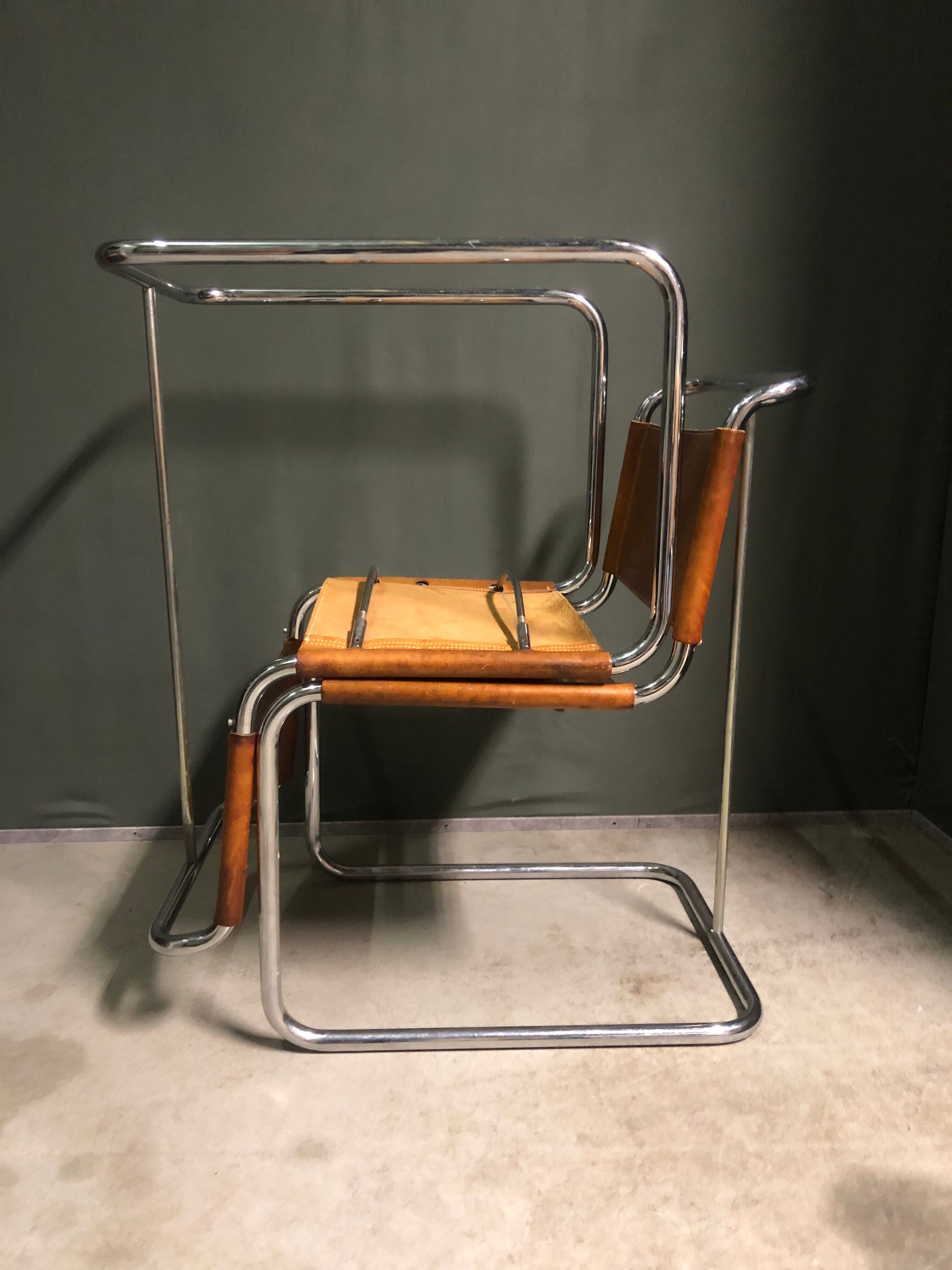 A pair of chromed tubular dining chairs 1980's