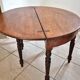 Half-moon table made of solid wood.
