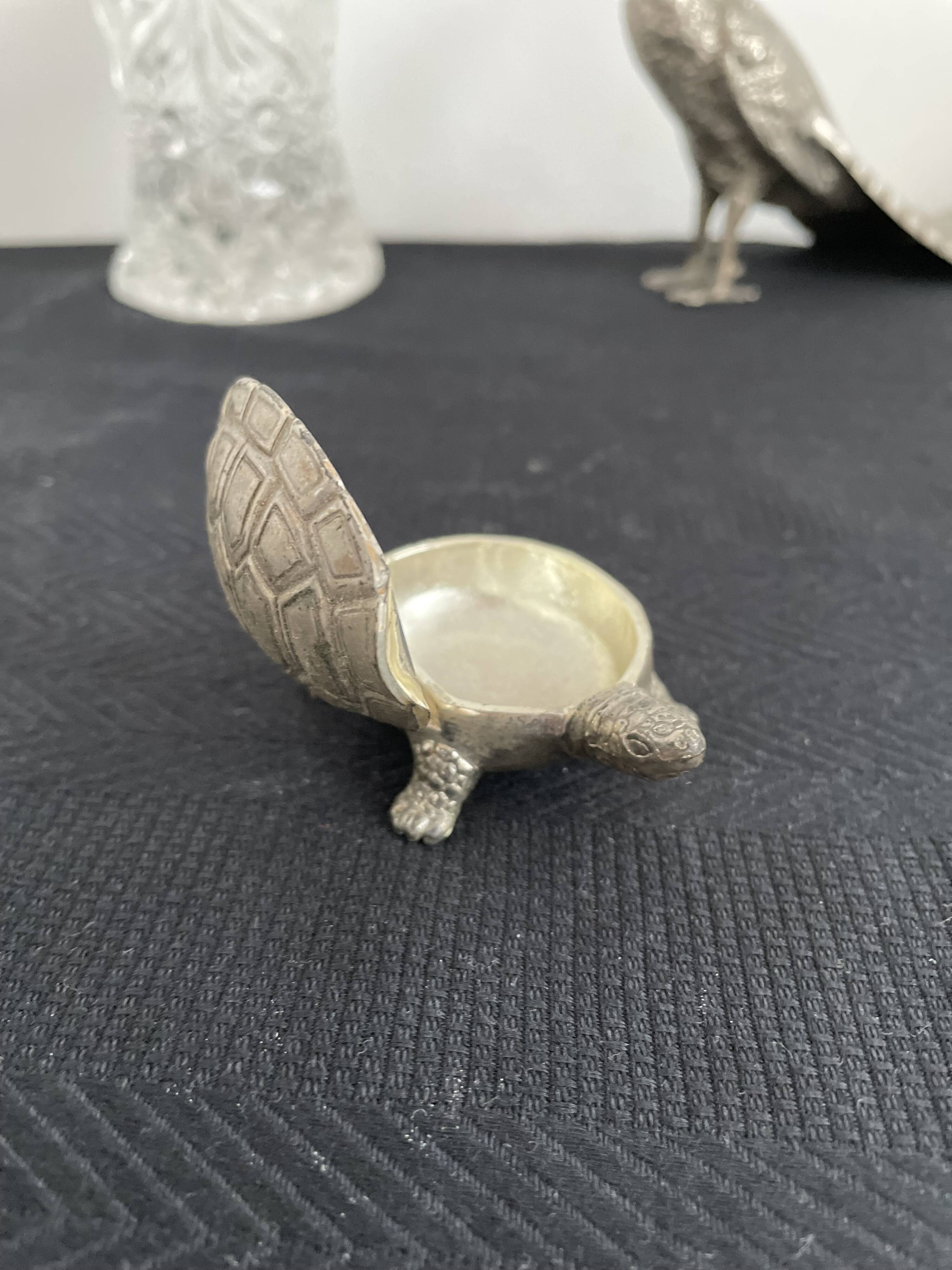 Ancient tortoise in silver metal