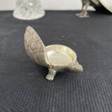 Ancient tortoise in silver metal